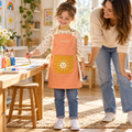 XVQZJM Sunny Play Apron — lifestyle view